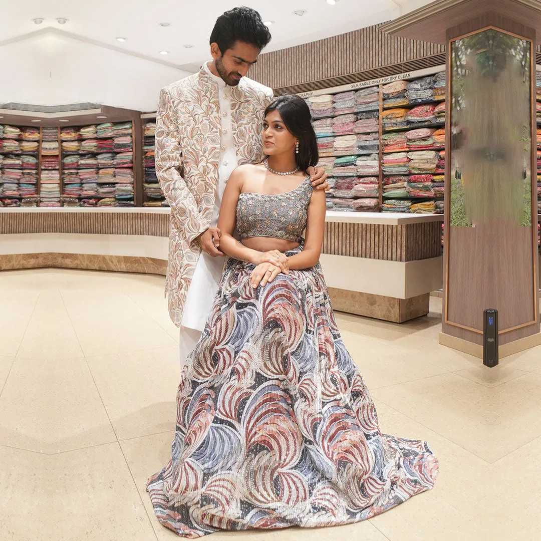 Abstract Blue Indo-Western Lehenga Set Complimented with Men's White Embroidered Sherwani