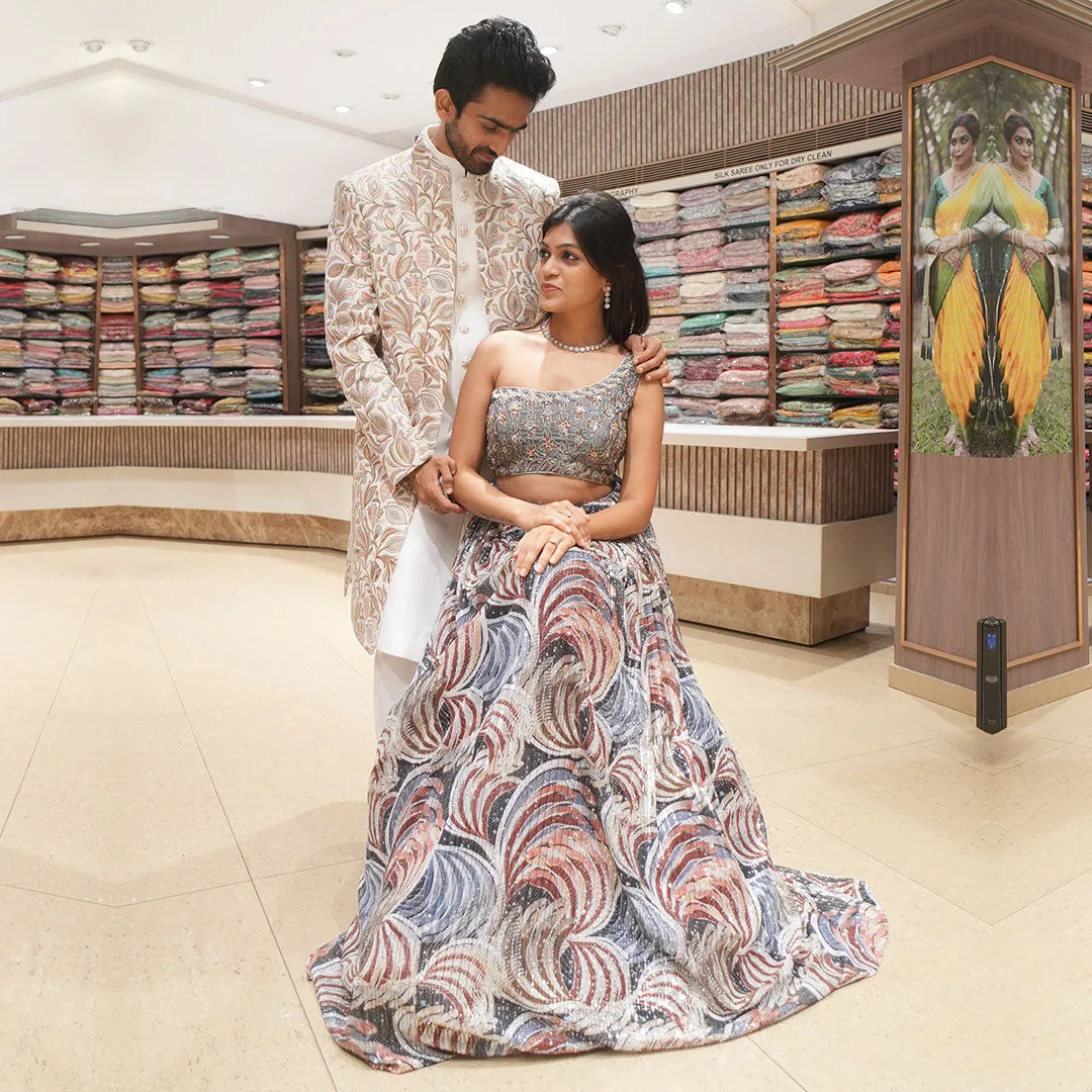 Abstract Blue Indo-Western Lehenga Set Complimented with Men's White Embroidered Sherwani