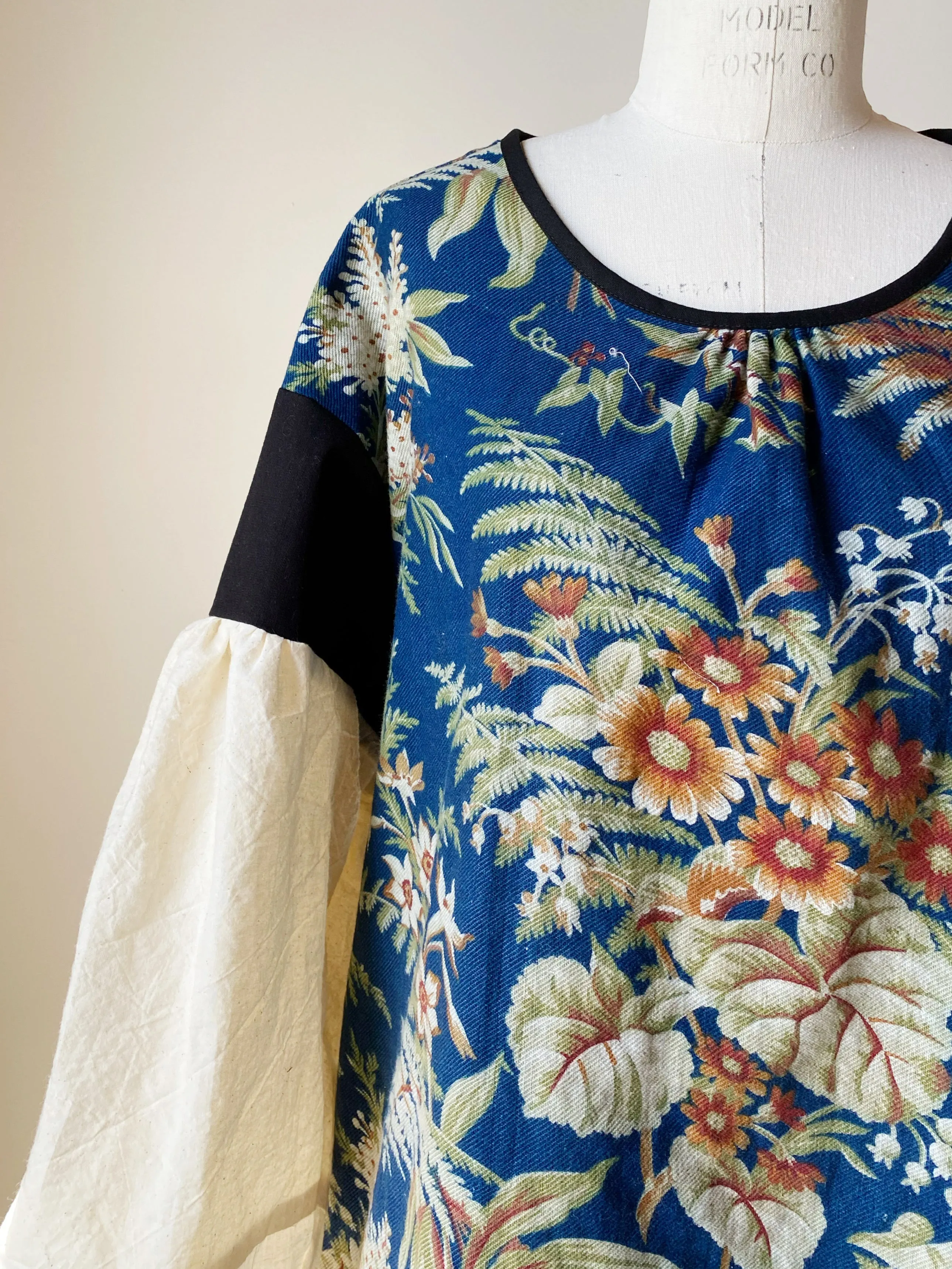 blue ground antique floral twill tie dress